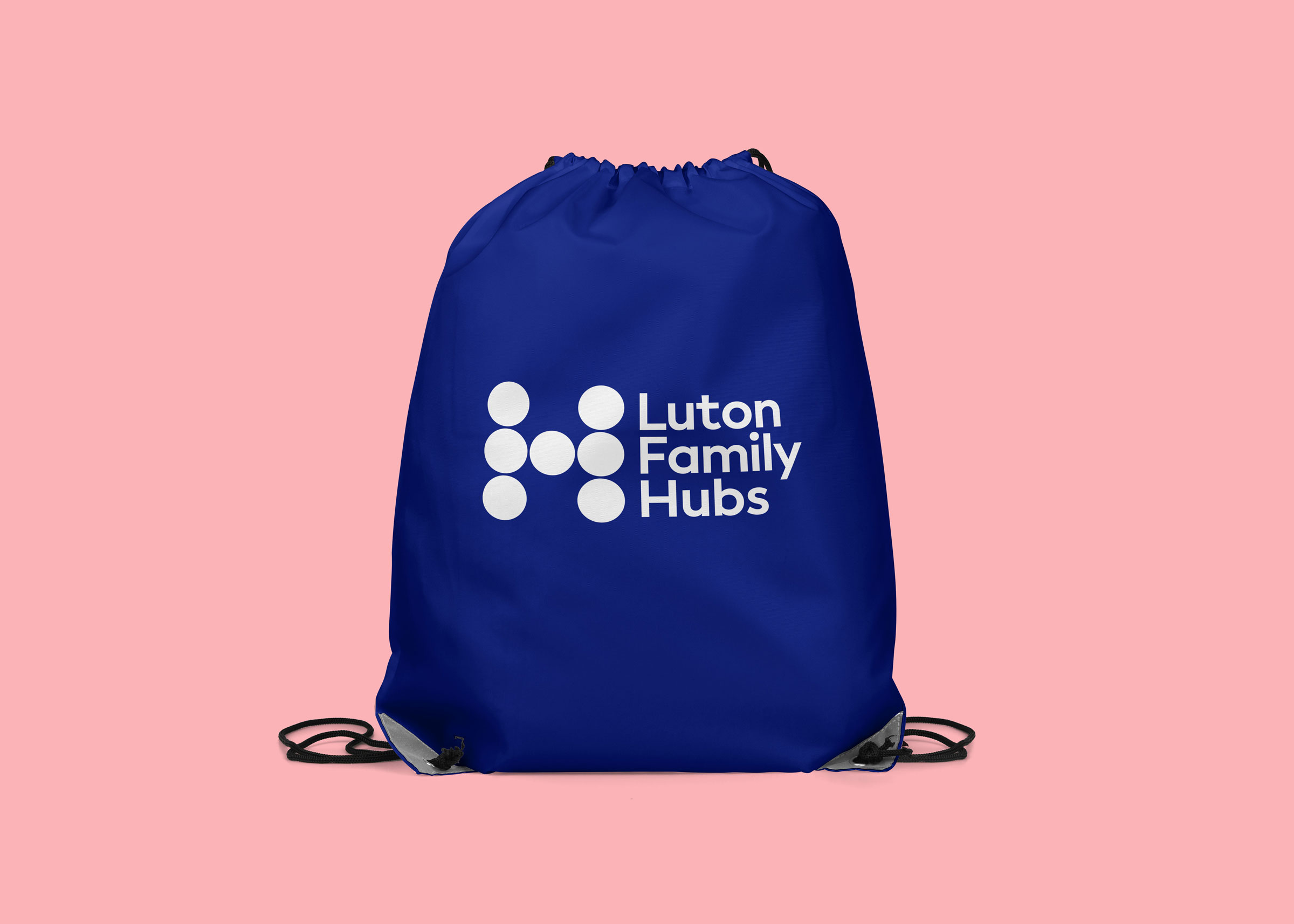 A gym kit bag using the brand identity of Luton Family Hubs
