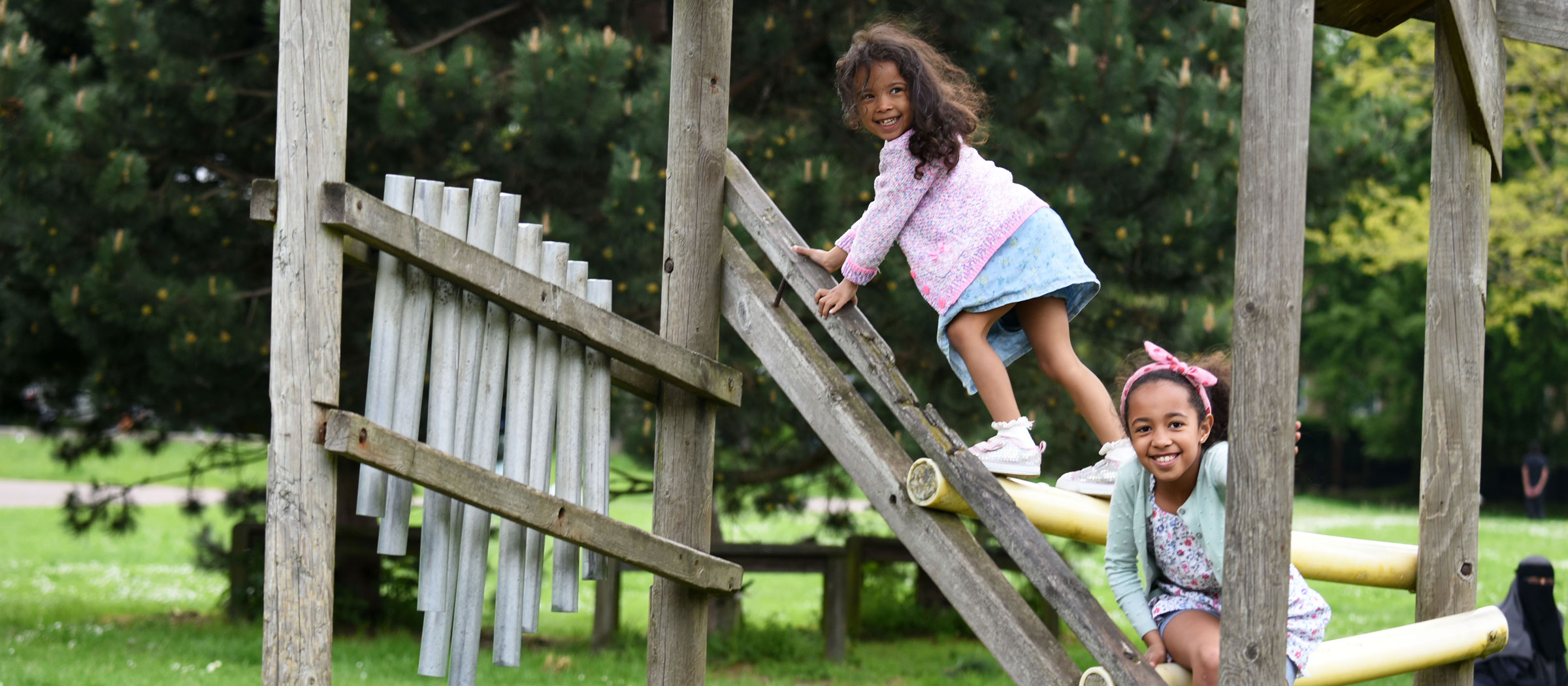 Children in Luton playing in a playground